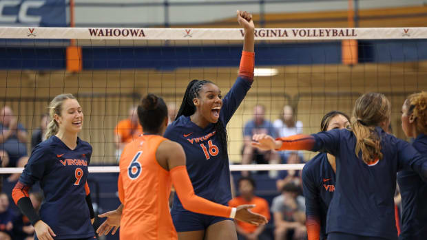 Veresia Yon celebrates after scoring a point during the Virginia volleyball match against Wofford at Memorial Gymnasium.